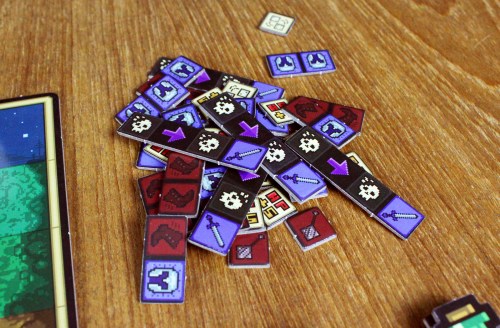 a pile of Rune tokens featuring upgrade icons for player characters