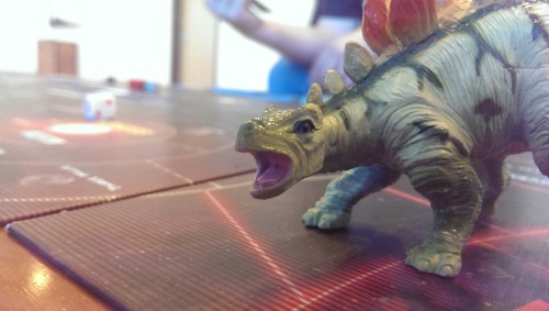Cornok the Firefly Dinosaur welcomes you to Gen Con!